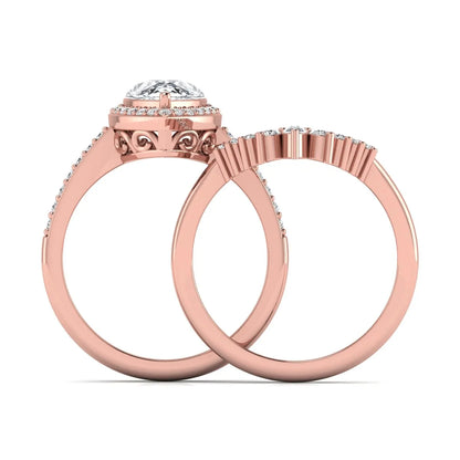 Pear Halo Crown Bridal Ring Set featuring a 10.00 × 7.00 mm pear-cut lab grown diamond with a pear-shaped halo, tiara-inspired crown diamond accents, cathedral pavé engagement ring, and matching contoured double-row pavé wedding band in rose gold