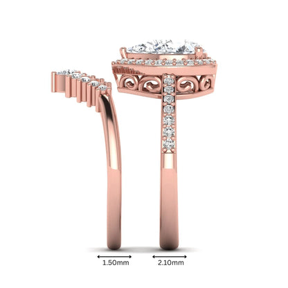 Pear Halo Crown Bridal Ring Set featuring a 10.00 × 7.00 mm pear-cut lab grown diamond with a pear-shaped halo, tiara-inspired crown diamond accents, cathedral pavé engagement ring, and matching contoured double-row pavé wedding band in rose gold