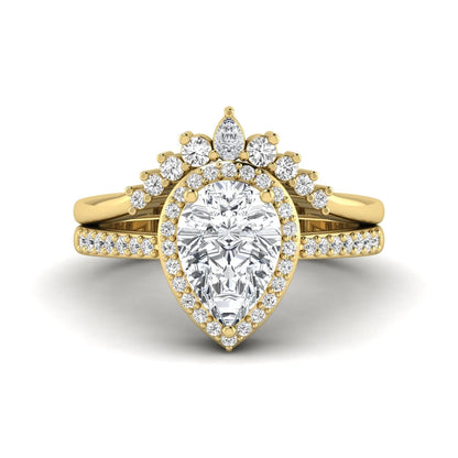 Pear Halo Crown Bridal Ring Set featuring a 10.00 × 7.00 mm pear-cut lab grown diamond with a pear-shaped halo, tiara-inspired crown diamond accents, cathedral pavé engagement ring, and matching contoured double-row pavé wedding band in yellow gold