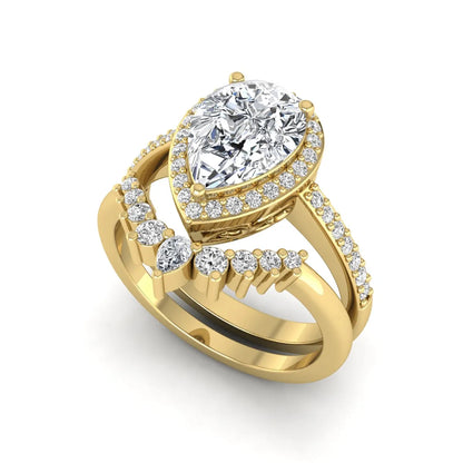 Pear Halo Crown Bridal Ring Set featuring a 10.00 × 7.00 mm pear-cut lab grown diamond with a pear-shaped halo, tiara-inspired crown diamond accents, cathedral pavé engagement ring, and matching contoured double-row pavé wedding band in yellow gold