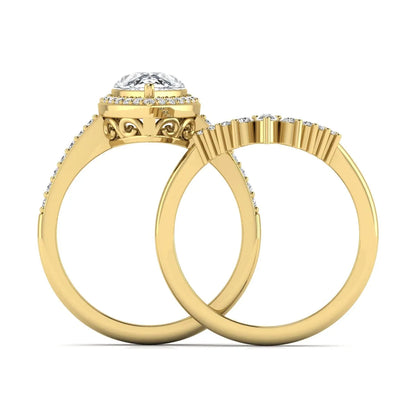 Pear Halo Crown Bridal Ring Set featuring a 10.00 × 7.00 mm pear-cut lab grown diamond with a pear-shaped halo, tiara-inspired crown diamond accents, cathedral pavé engagement ring, and matching contoured double-row pavé wedding band in yellow gold