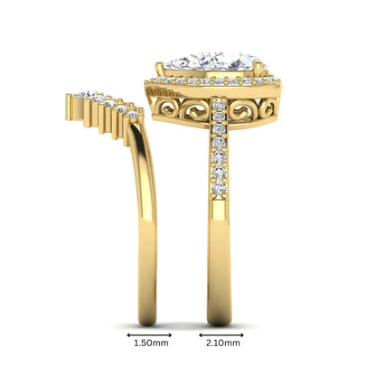 Pear Halo Crown Bridal Ring Set featuring a 10.00 × 7.00 mm pear-cut lab grown diamond with a pear-shaped halo, tiara-inspired crown diamond accents, cathedral pavé engagement ring, and matching contoured double-row pavé wedding band in yellow gold