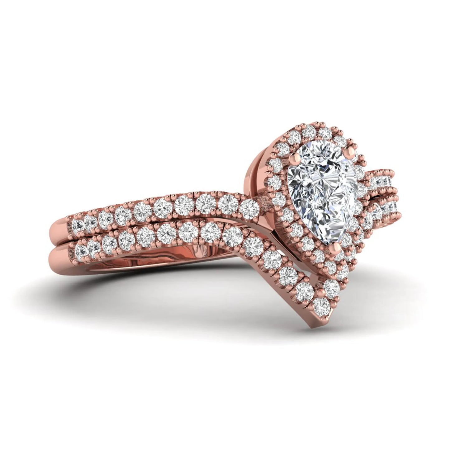 Pear cut lab grown diamond bridal ring set featuring a halo engagement ring with a matching curved pavé wedding band in a rose gold tone design.