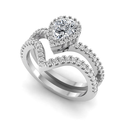 Pear cut lab grown diamond bridal ring set featuring a halo engagement ring with a matching curved pavé wedding band in a white gold tone design.