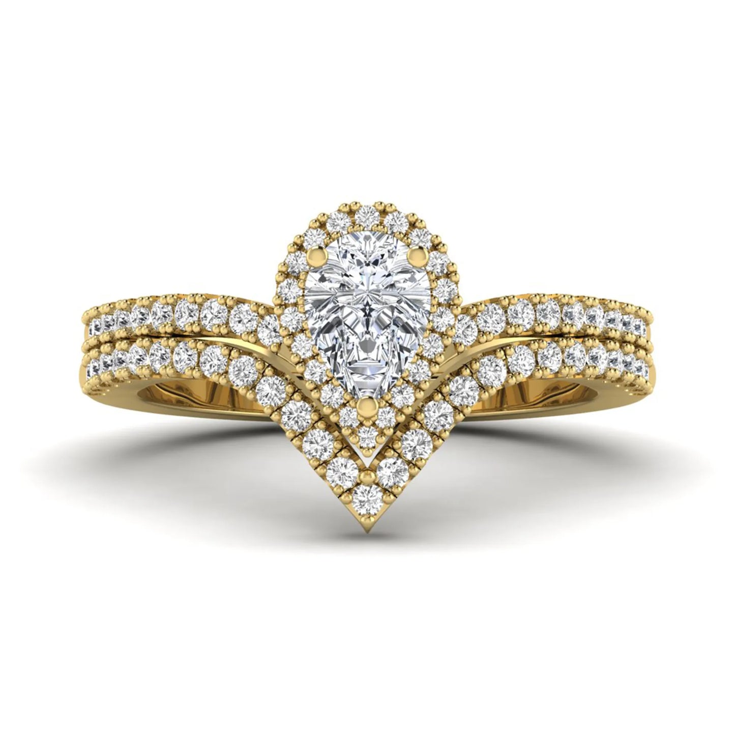 Pear cut lab grown diamond bridal ring set featuring a halo engagement ring with a matching curved pavé wedding band in a yellow gold tone design.