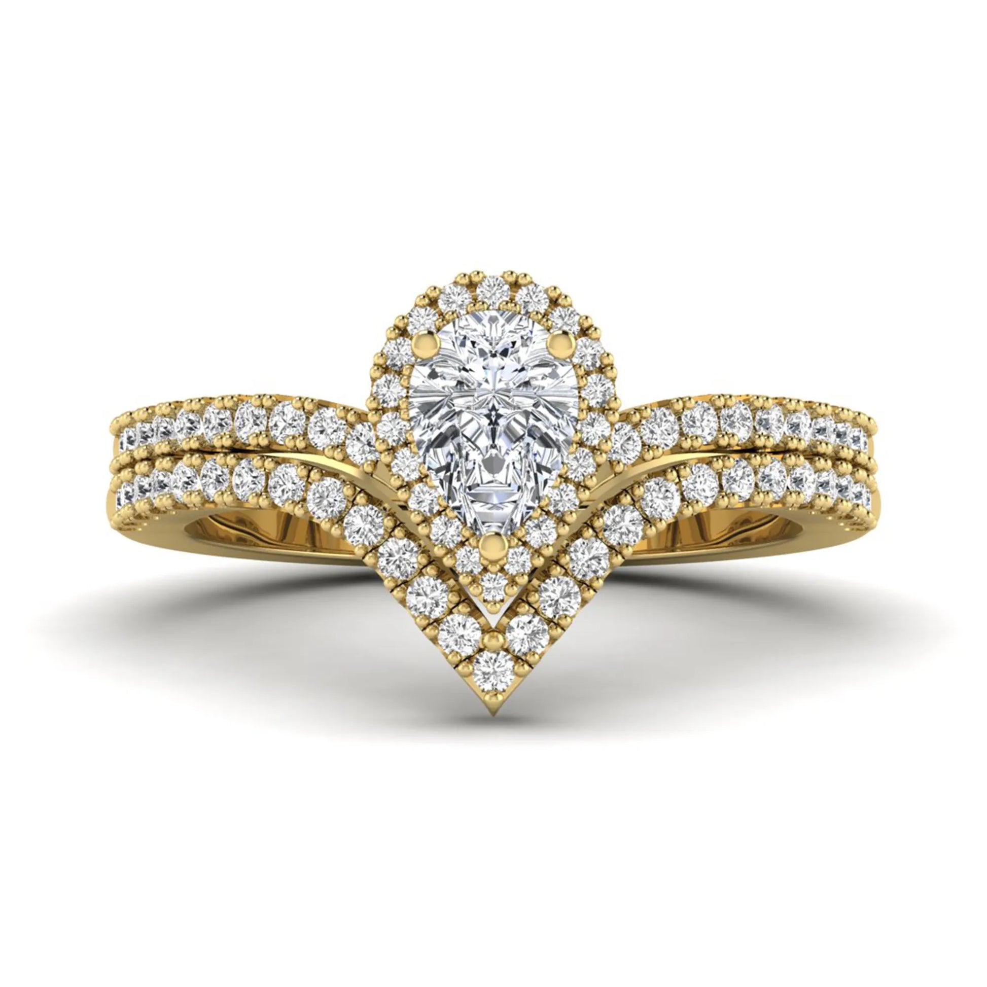 Pear cut lab grown diamond bridal ring set featuring a halo engagement ring with a matching curved pavé wedding band in a yellow gold tone design.