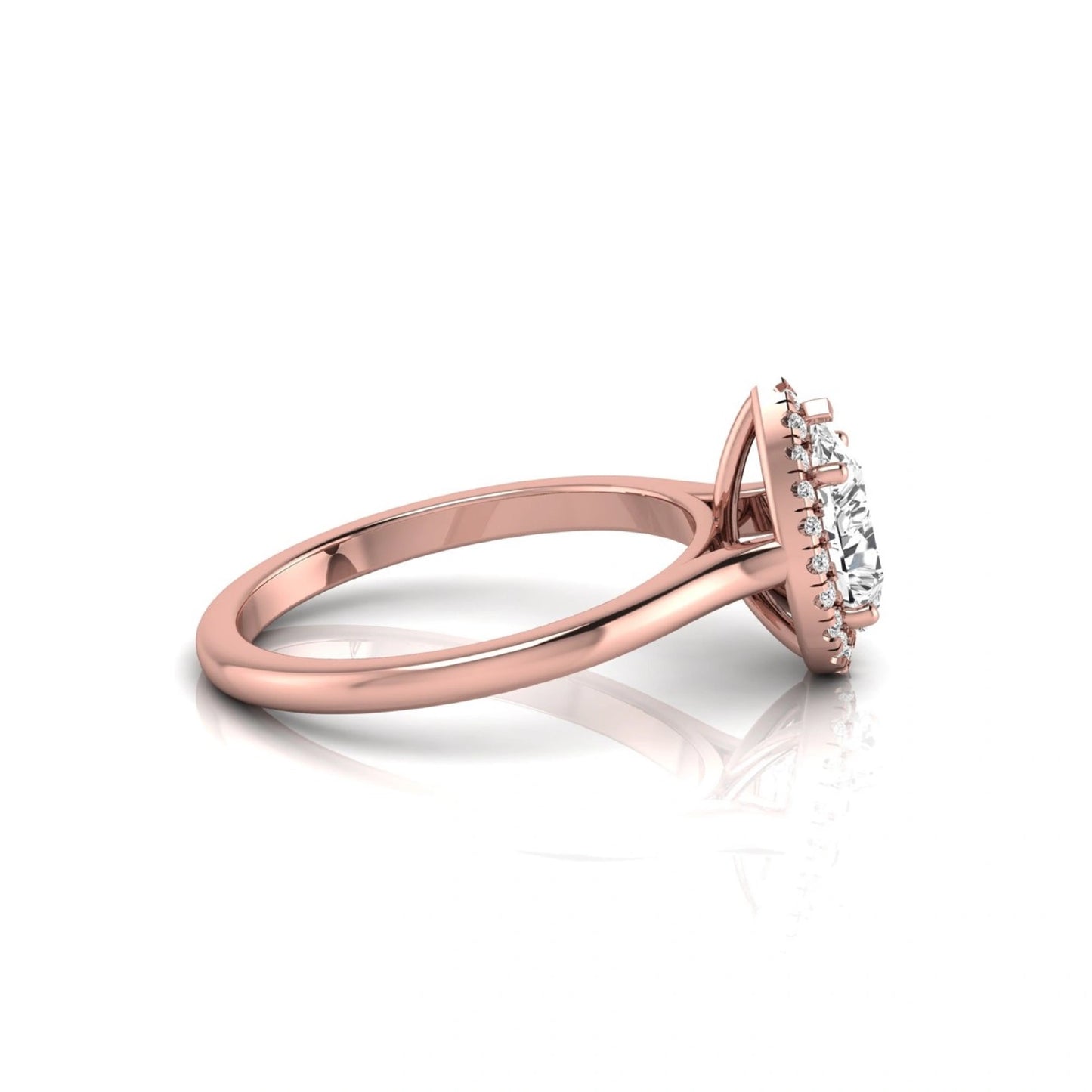 Pear cut lab grown diamond engagement ring featuring a 1.33 carat center diamond surrounded by a sparkling round diamond halo with a polished rose gold band.