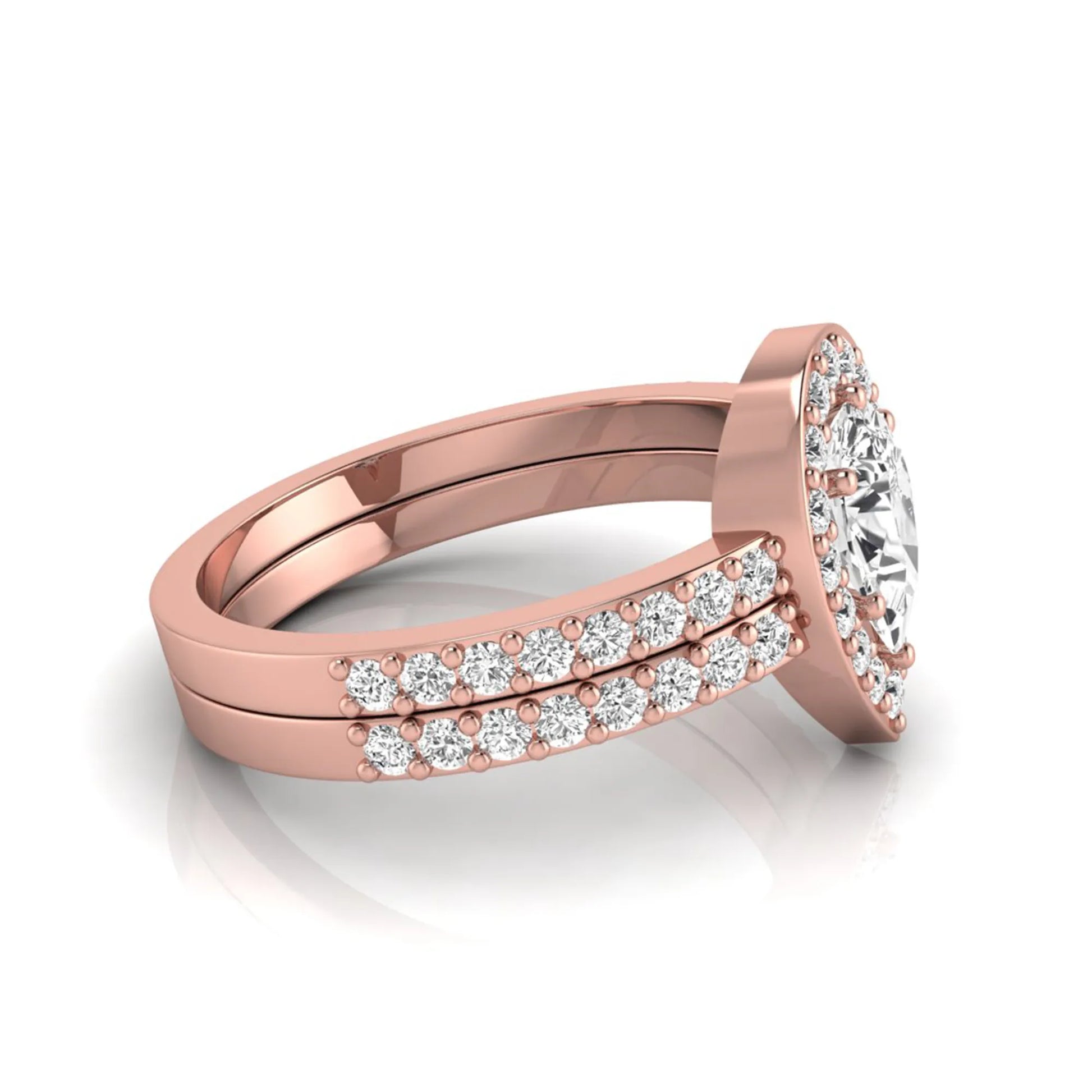 Pear cut lab grown diamond engagement ring with a round diamond halo and double-row pavé band in a rose gold style design.