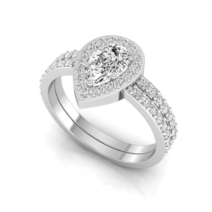 Pear cut lab grown diamond engagement ring with a round diamond halo and double-row pavé band in a white gold style design.