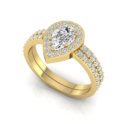 Pear cut lab grown diamond engagement ring with a round diamond halo and double-row pavé band in a yellow gold style design.