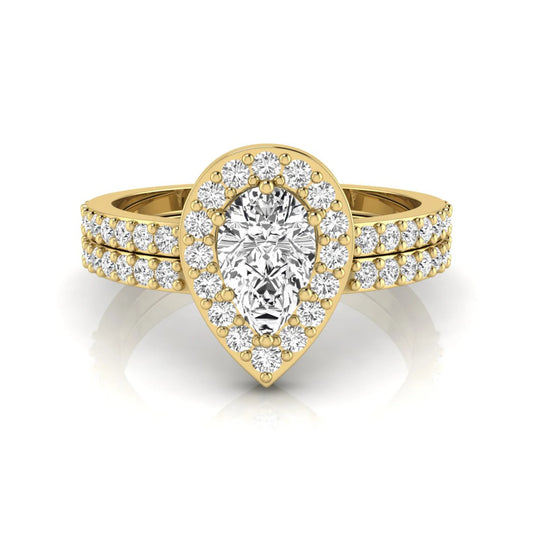 Pear cut lab grown diamond engagement ring with a round diamond halo and double-row pavé band in a yellow gold style design.