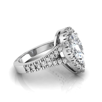Pear cut halo lab grown diamond engagement ring with round accent diamonds and split shank design in white gold metal tone