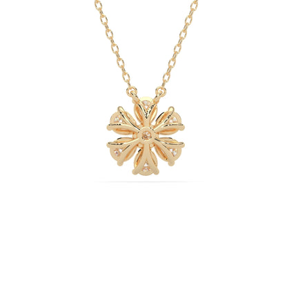 Pear cut and round lab grown diamond flower pendant necklace with prong setting in yellow gold tone on chain.
