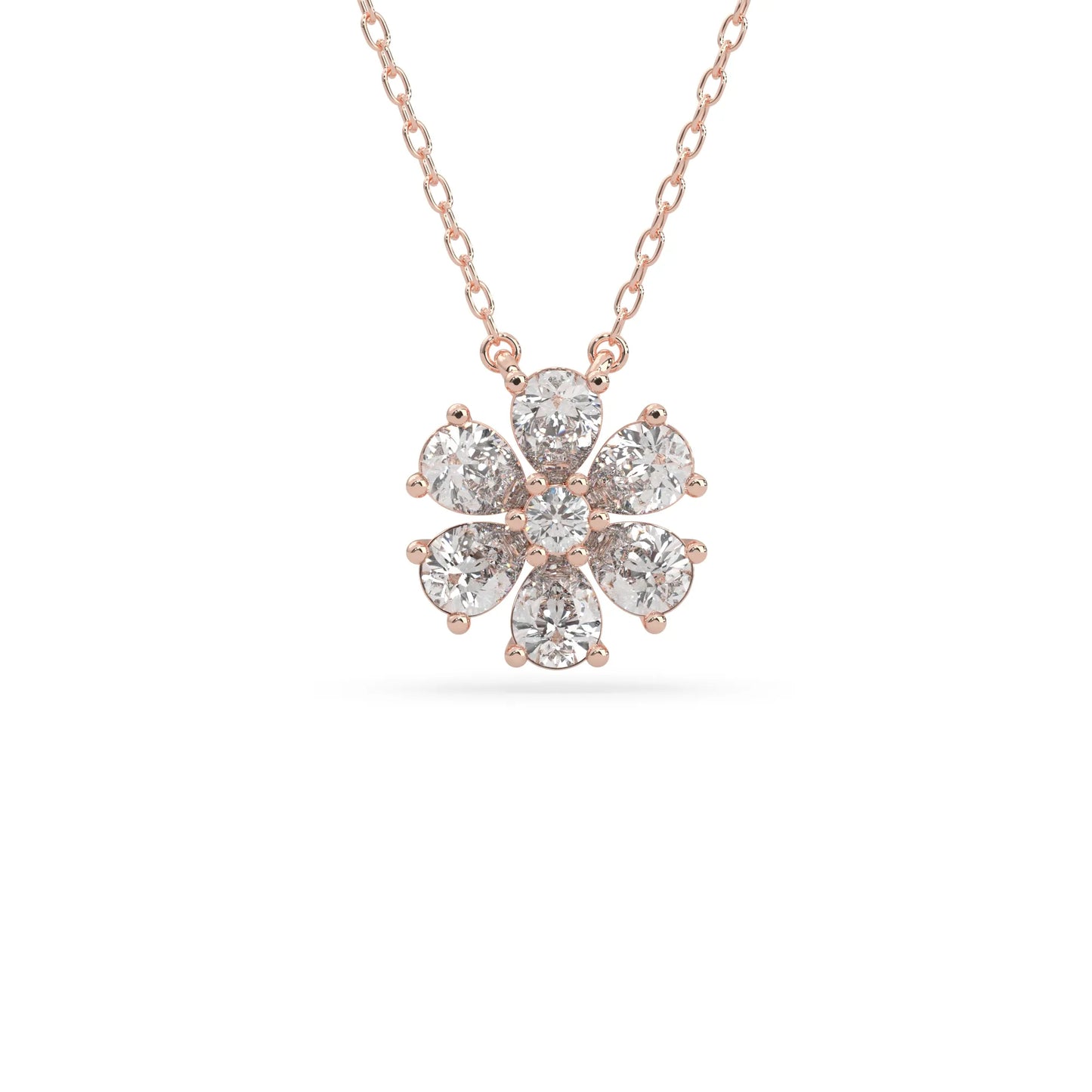 Pear cut and round lab grown diamond flower pendant necklace with prong setting in rose gold tone on chain.