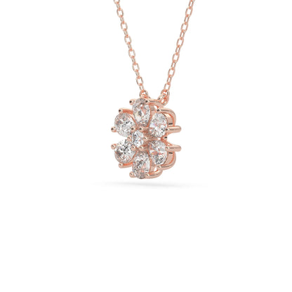 Pear cut and round lab grown diamond flower pendant necklace with prong setting in rose gold tone on chain.