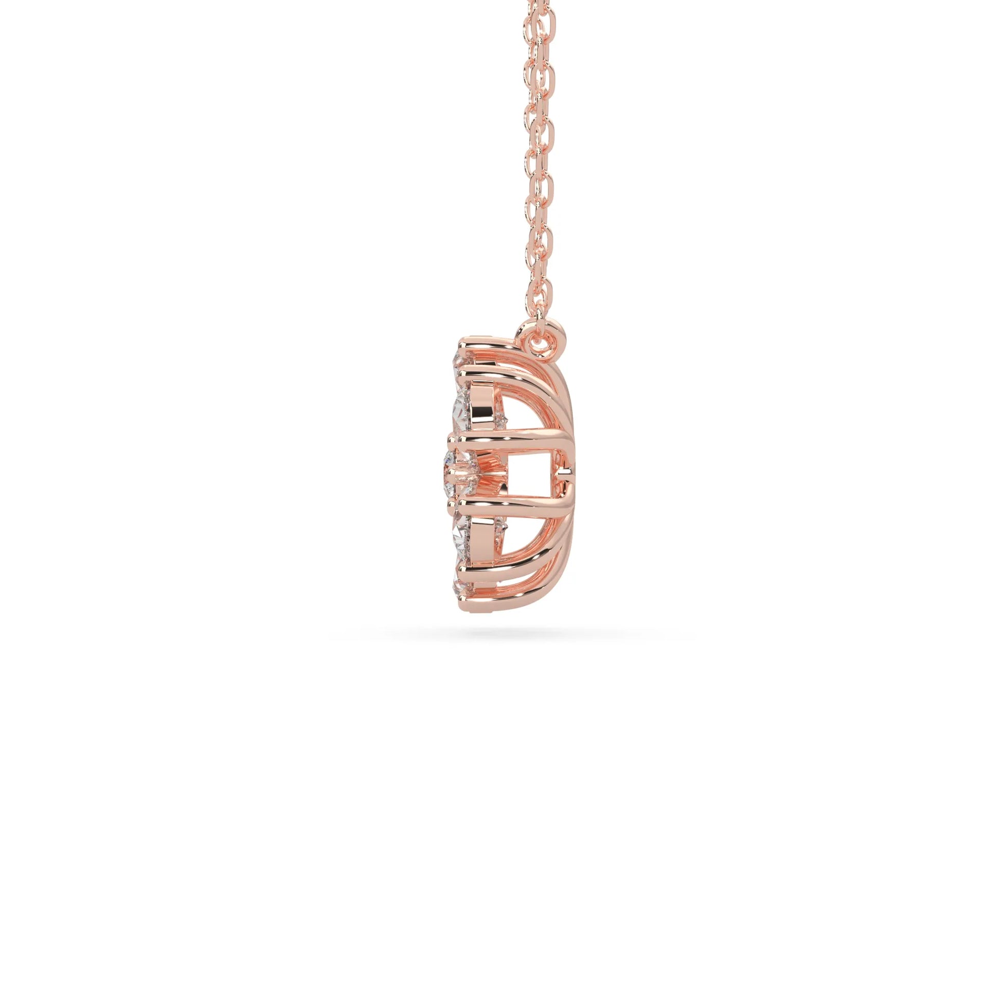 Pear cut and round lab grown diamond flower pendant necklace with prong setting in rose gold tone on chain.