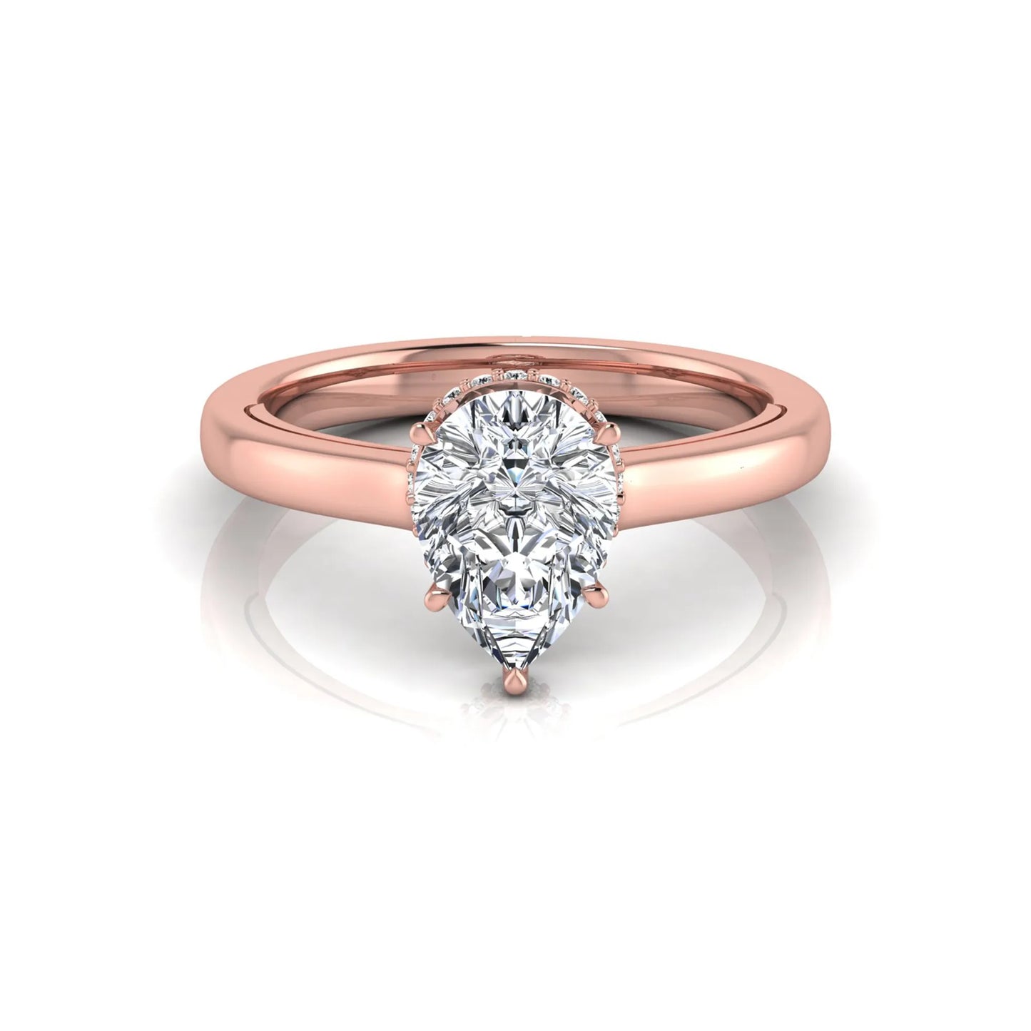 Pear cut lab grown diamond engagement ring featuring a hidden halo of round diamonds in a six-prong setting with a polished rose gold tone band.