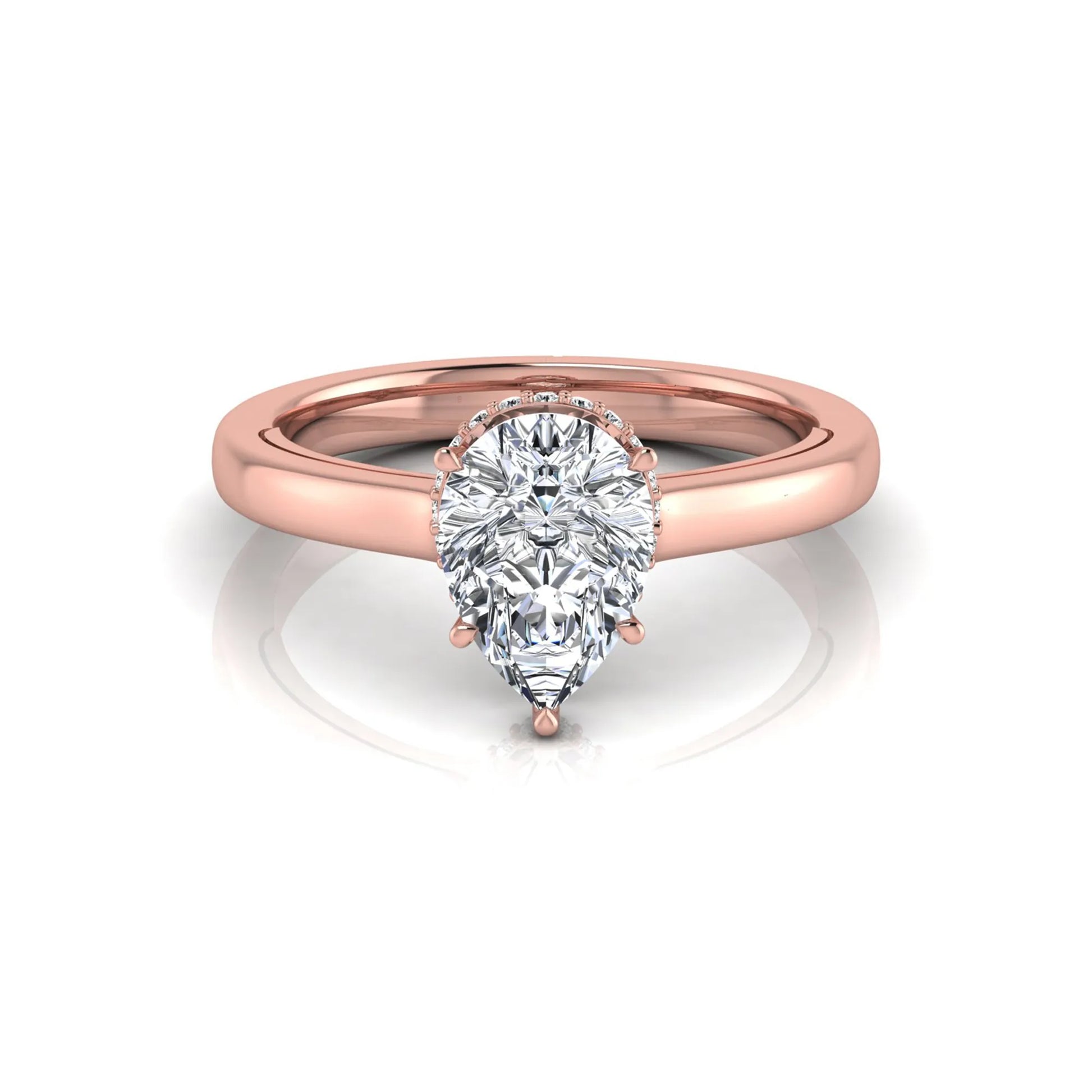 Pear cut lab grown diamond engagement ring featuring a hidden halo of round diamonds in a six-prong setting with a polished rose gold tone band.