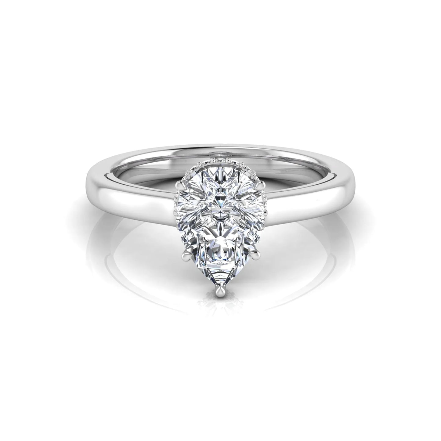 Pear cut lab grown diamond engagement ring featuring a hidden halo of round diamonds in a six-prong setting with a polished white gold tone band.