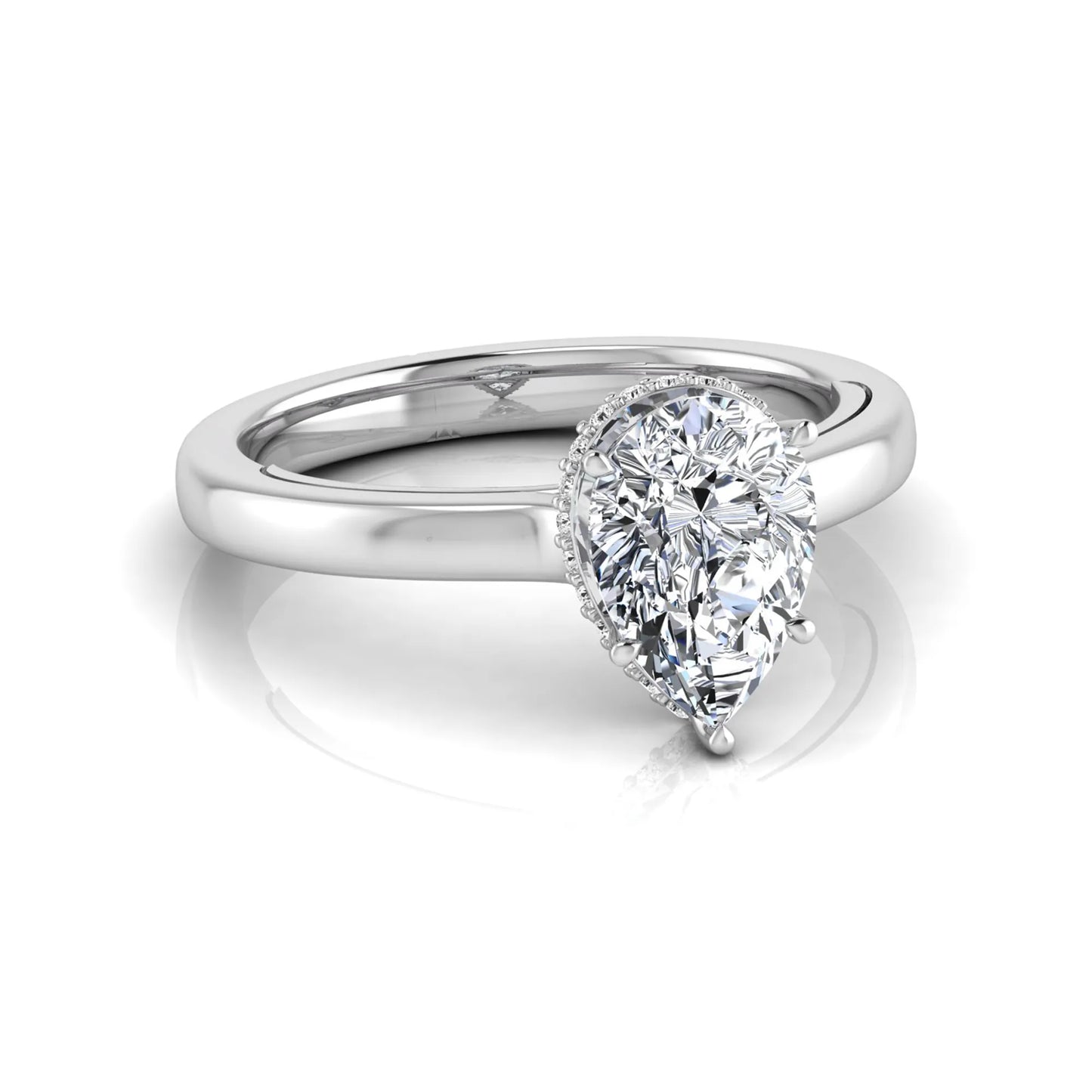 Pear cut lab grown diamond engagement ring featuring a hidden halo of round diamonds in a six-prong setting with a polished white gold tone band.