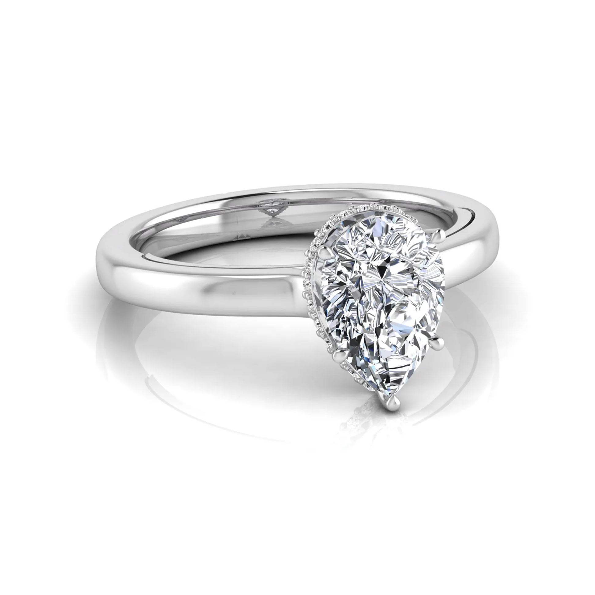 Pear cut lab grown diamond engagement ring featuring a hidden halo of round diamonds in a six-prong setting with a polished white gold tone band.