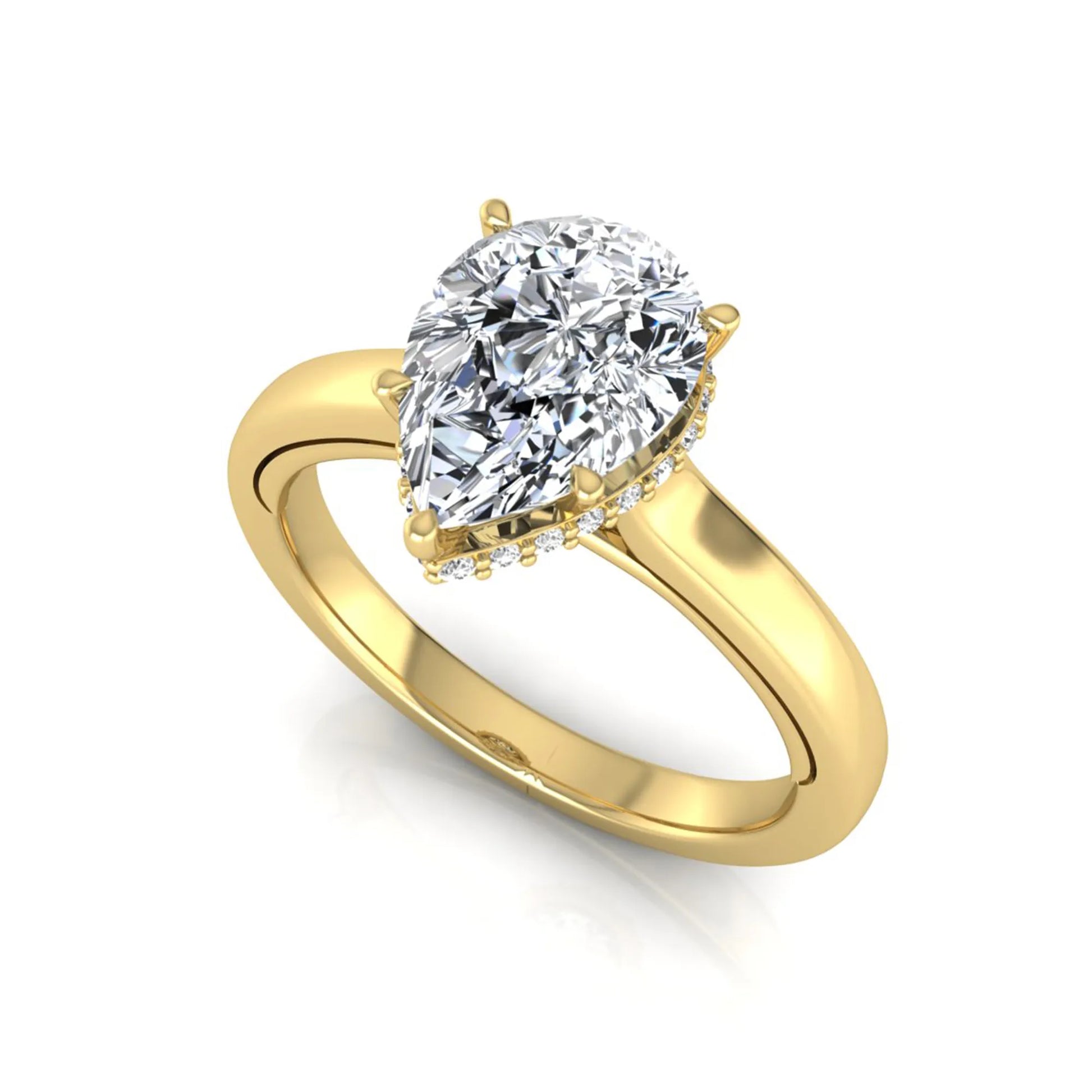 Pear cut lab grown diamond engagement ring featuring a hidden halo of round diamonds in a six-prong setting with a polished yellow gold tone band.