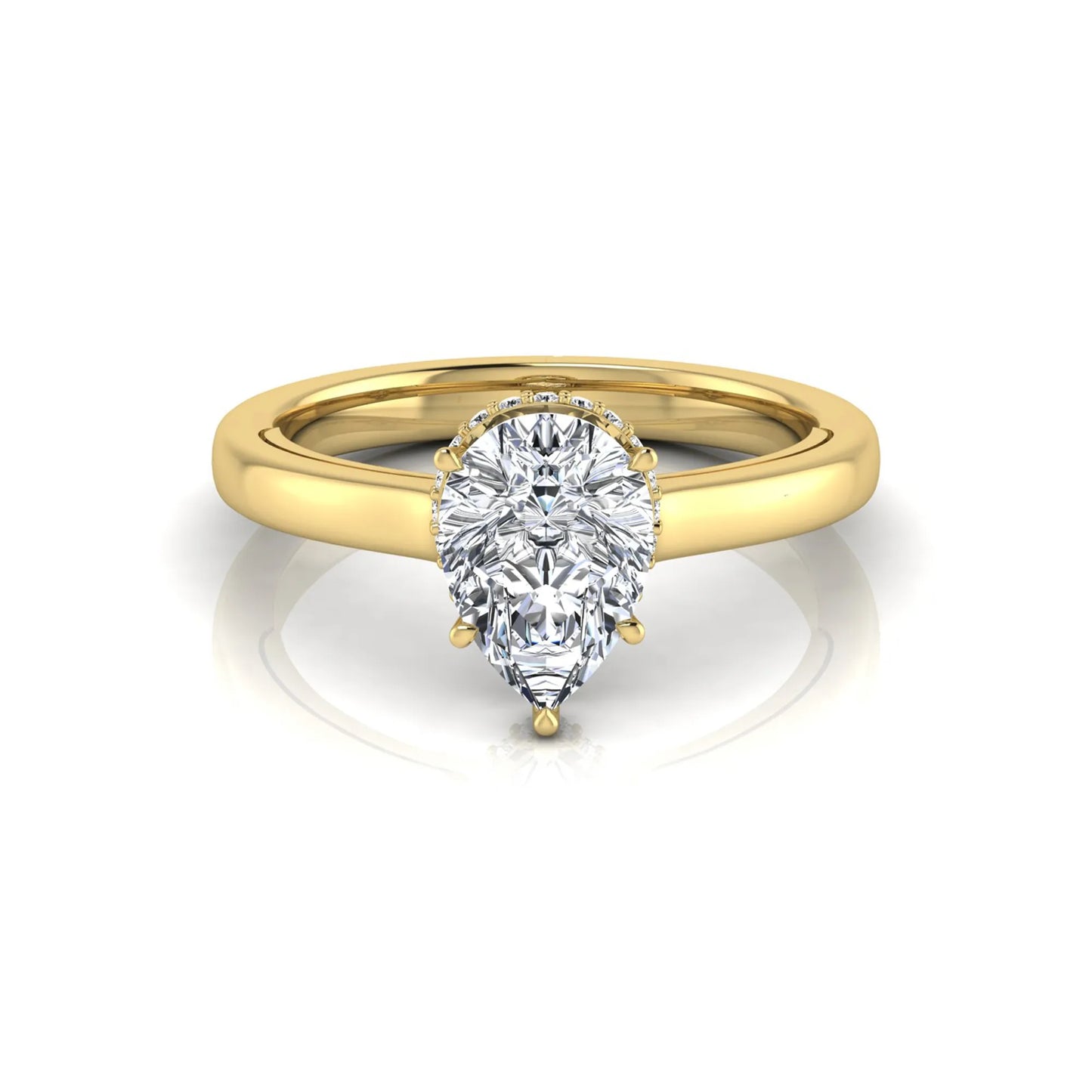 Pear cut lab grown diamond engagement ring featuring a hidden halo of round diamonds in a six-prong setting with a polished yellow gold tone band.