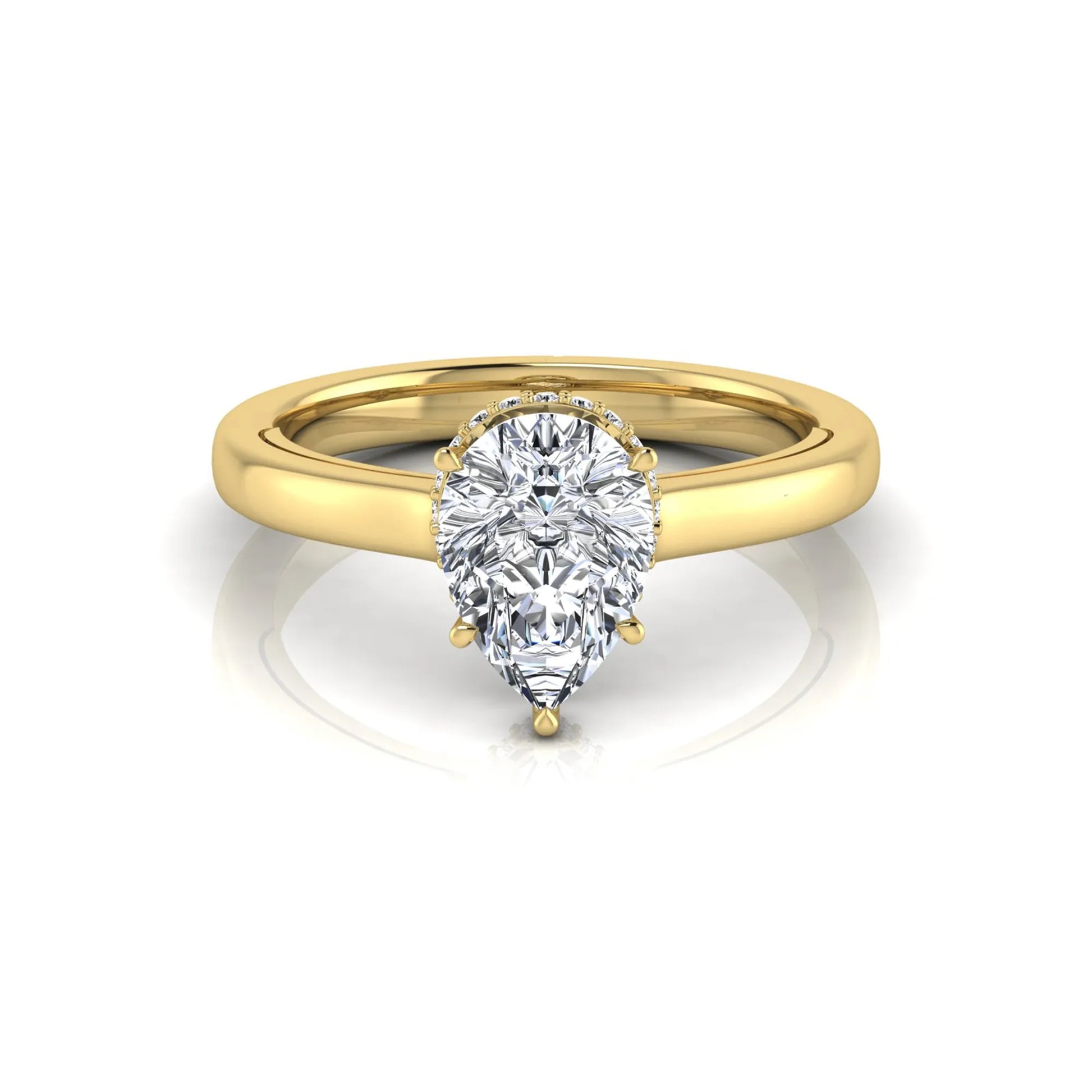 Pear cut lab grown diamond engagement ring featuring a hidden halo of round diamonds in a six-prong setting with a polished yellow gold tone band.