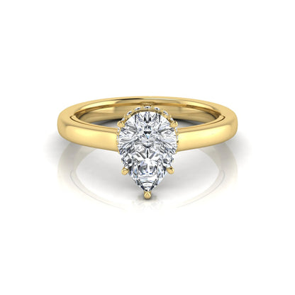 Pear cut lab grown diamond engagement ring featuring a hidden halo of round diamonds in a six-prong setting with a polished yellow gold tone band.