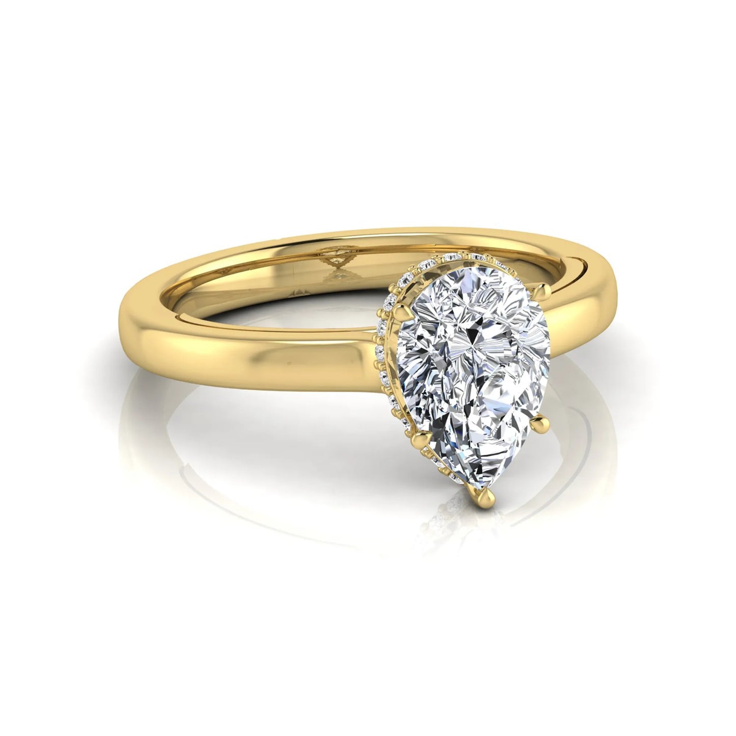 Pear cut lab grown diamond engagement ring featuring a hidden halo of round diamonds in a six-prong setting with a polished yellow gold tone band.