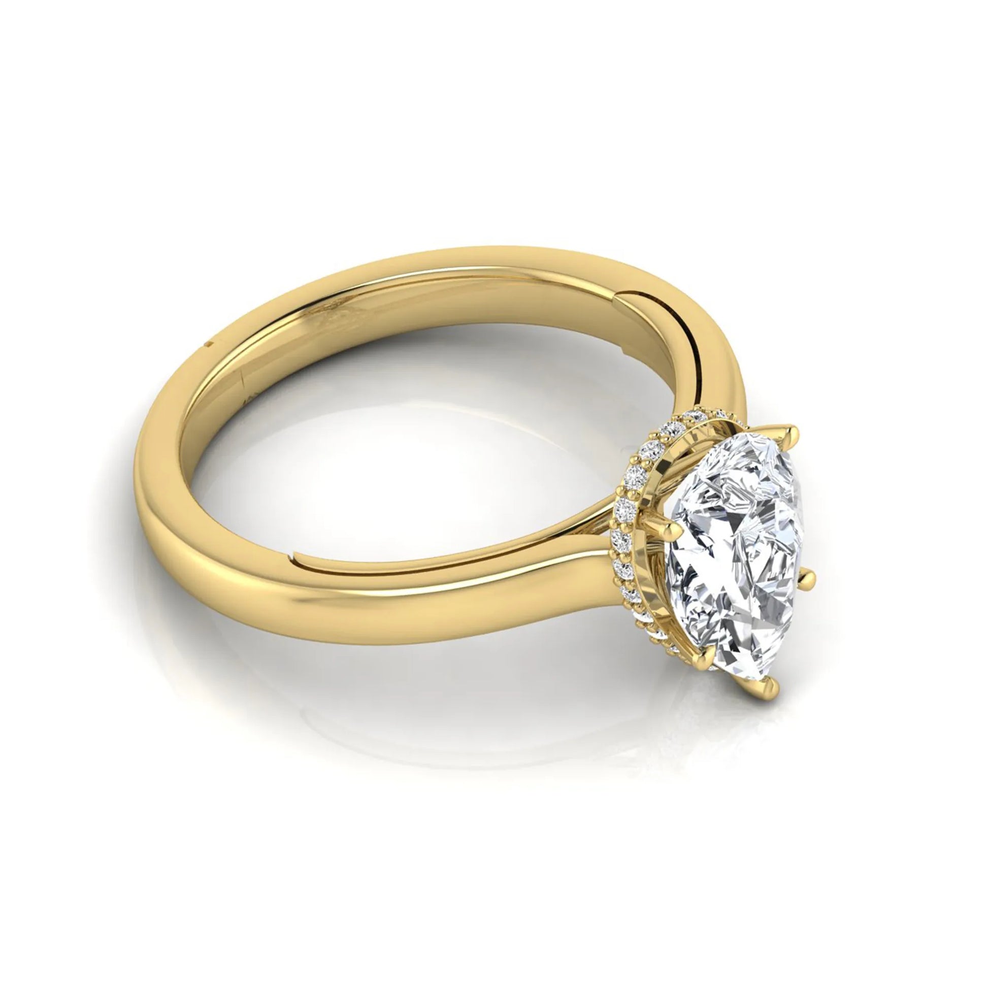 Pear cut lab grown diamond engagement ring featuring a hidden halo of round diamonds in a six-prong setting with a polished yellow gold tone band.