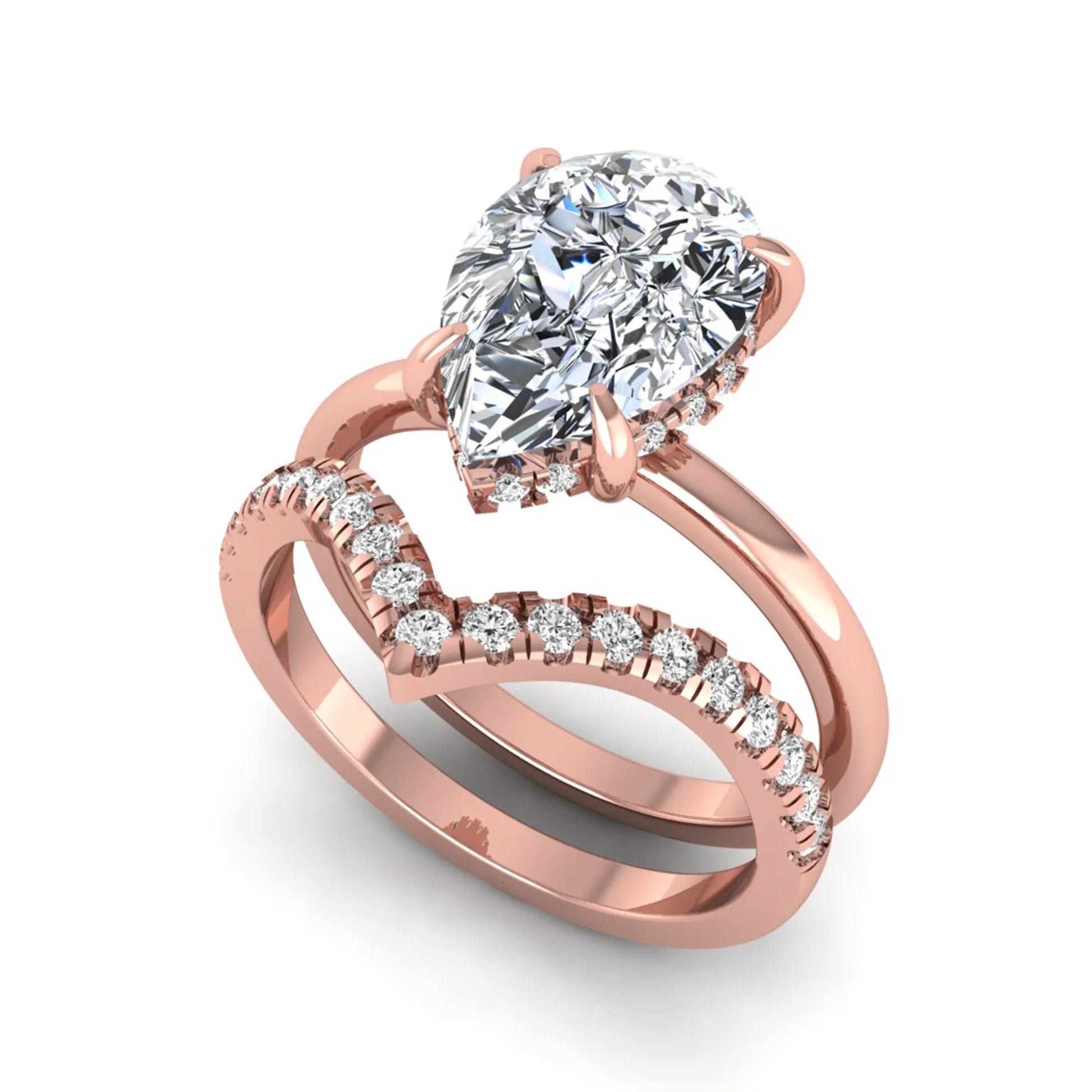 Pear cut lab grown diamond hidden halo solitaire bridal ring set featuring a four-prong engagement ring with a matching pavé chevron wedding band in rose gold.