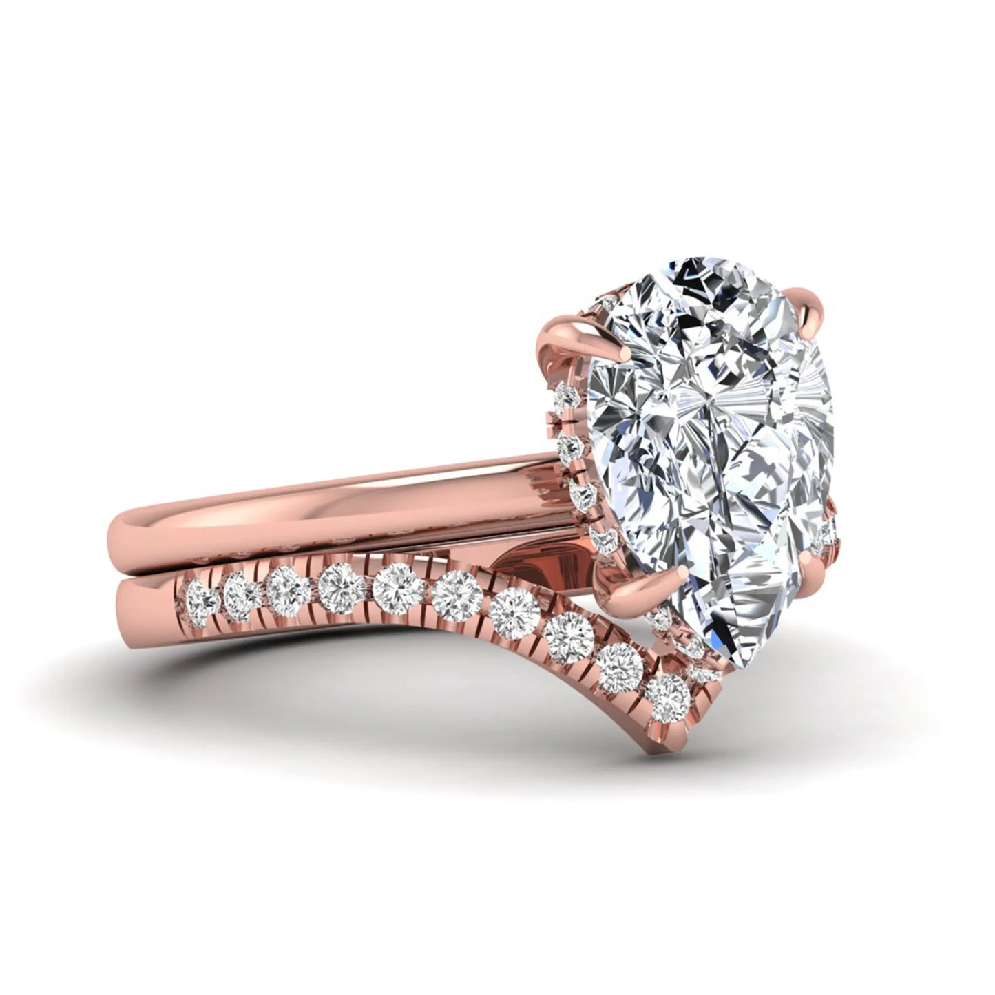Pear cut lab grown diamond hidden halo solitaire bridal ring set featuring a four-prong engagement ring with a matching pavé chevron wedding band in rose gold.