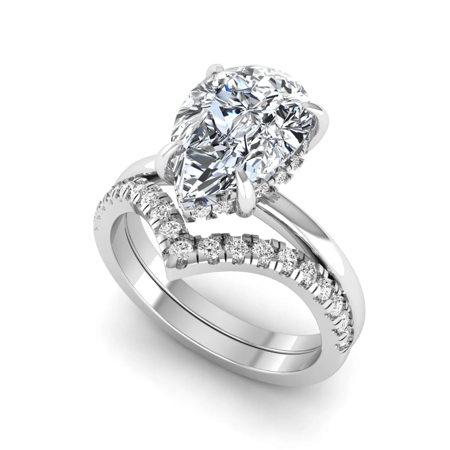 Pear cut lab grown diamond hidden halo solitaire bridal ring set featuring a four-prong engagement ring with a matching pavé chevron wedding band in white gold.