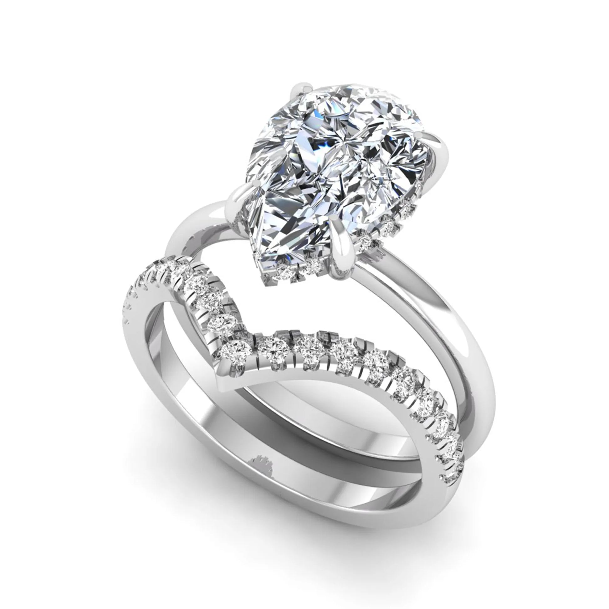 Pear cut lab grown diamond hidden halo solitaire bridal ring set featuring a four-prong engagement ring with a matching pavé chevron wedding band in white gold.
