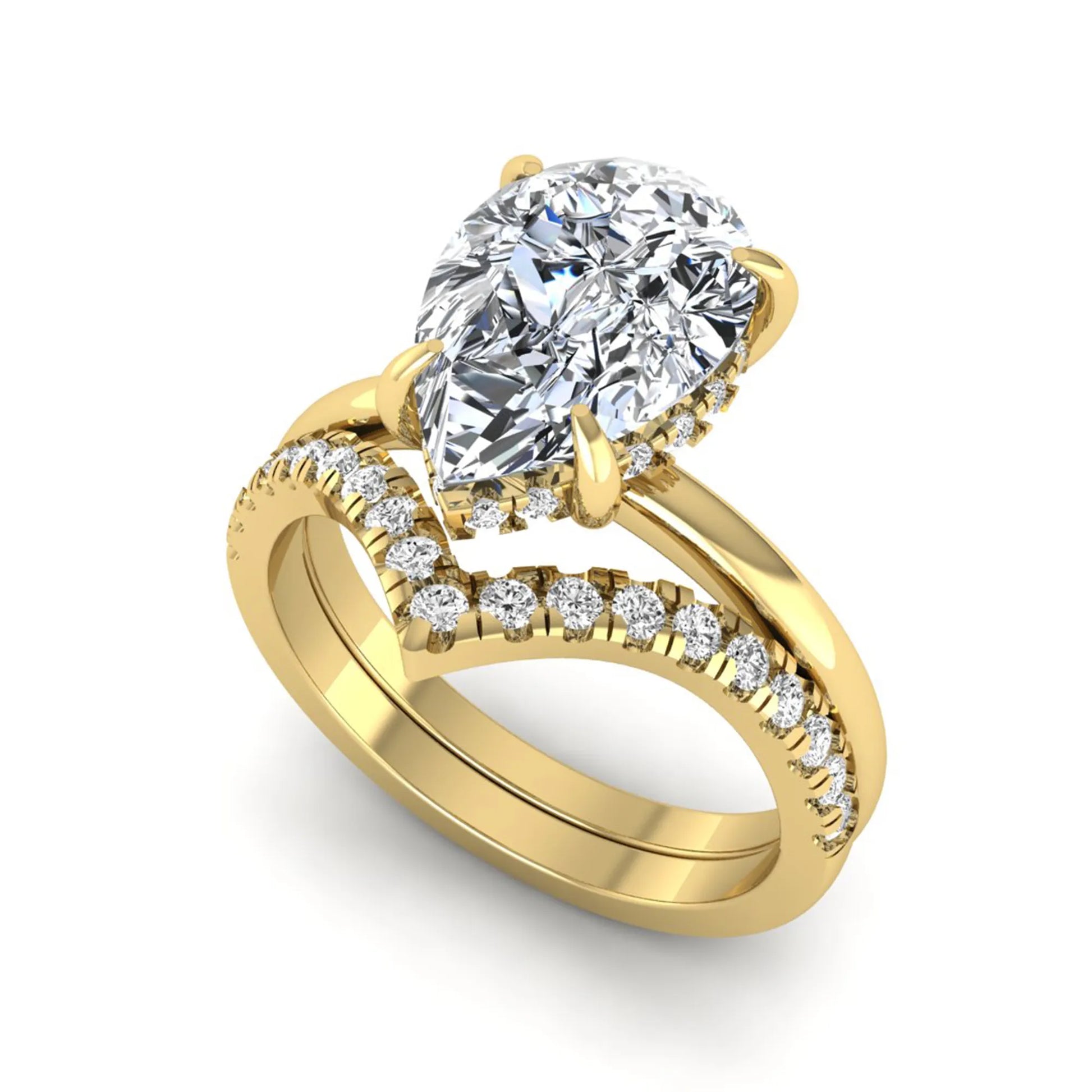 Pear cut lab grown diamond hidden halo solitaire bridal ring set featuring a four-prong engagement ring with a matching pavé chevron wedding band in yellow gold.