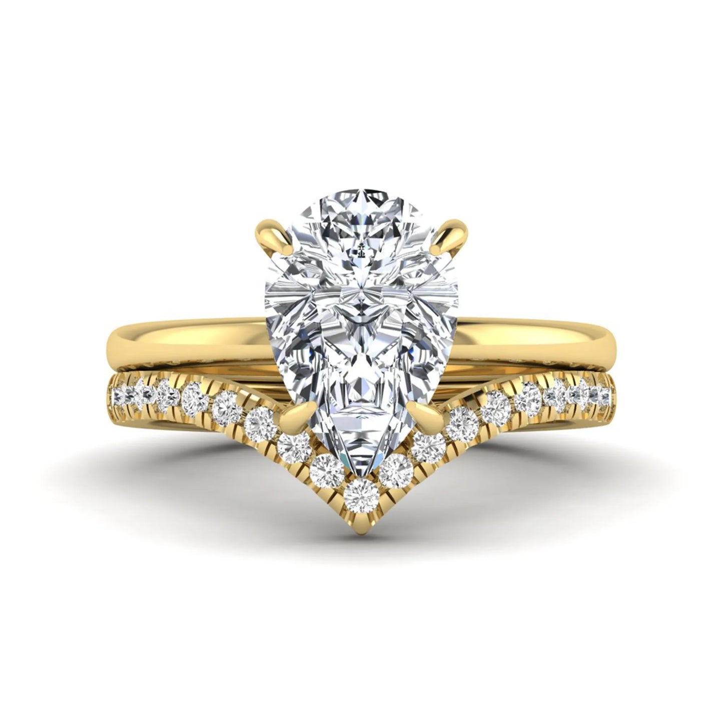 Pear cut lab grown diamond hidden halo solitaire bridal ring set featuring a four-prong engagement ring with a matching pavé chevron wedding band in yellow gold.