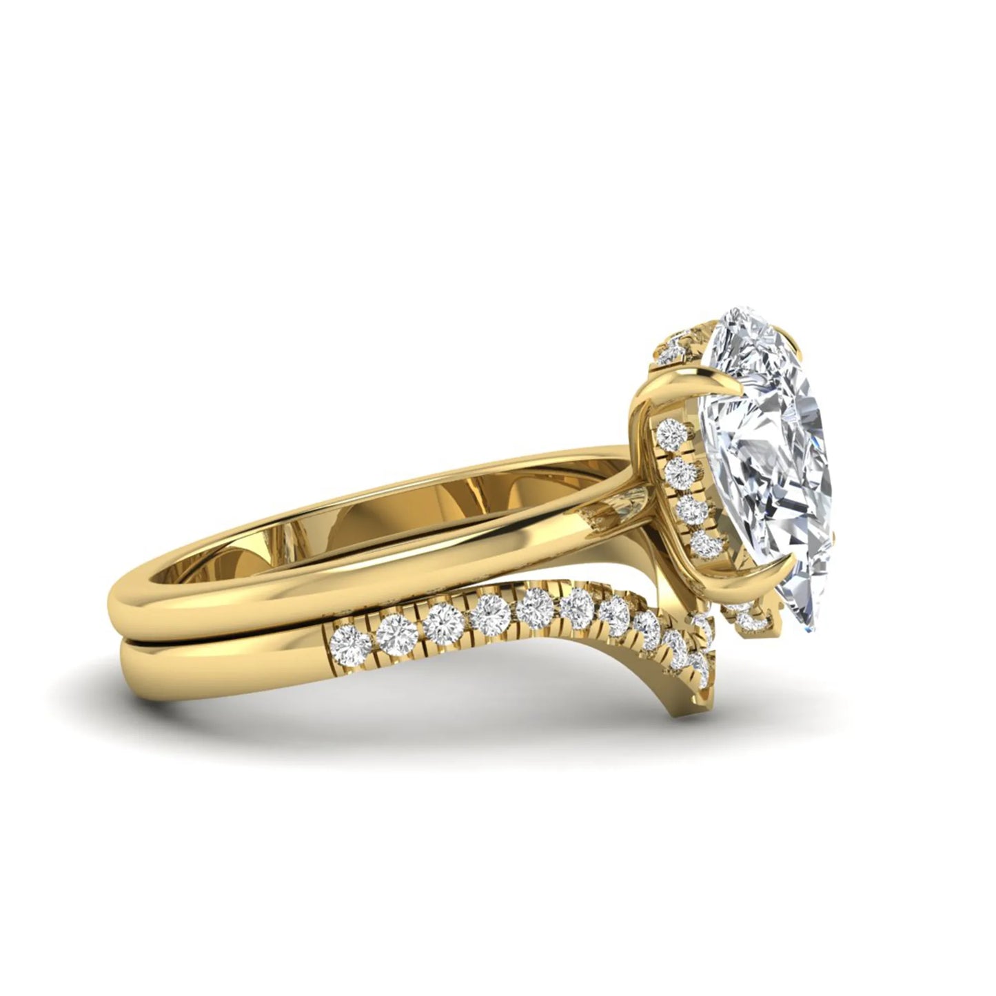 Pear cut lab grown diamond hidden halo solitaire bridal ring set featuring a four-prong engagement ring with a matching pavé chevron wedding band in yellow gold.