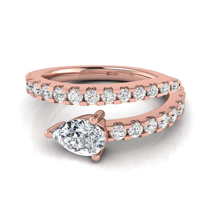 Pear cut lab grown diamond double wrap ring with pavé round diamond bands in polished rose gold.