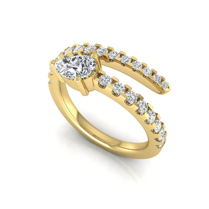 Pear cut lab grown diamond double wrap ring with pavé round diamond bands in polished yellow gold.