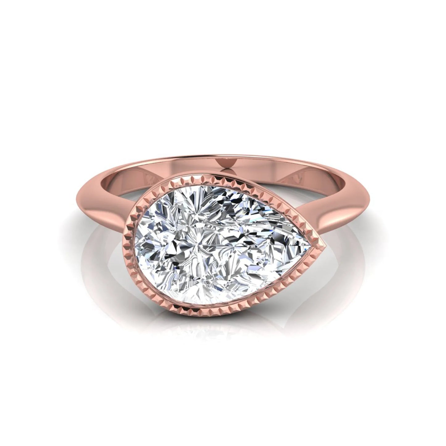 Pear cut lab grown diamond solitaire engagement ring featuring a milgrain bezel setting with a rose gold tone band.
