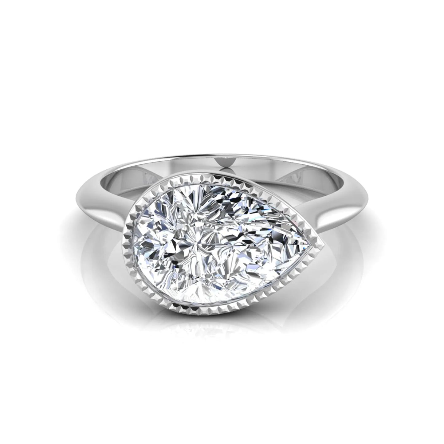 Pear cut lab grown diamond solitaire engagement ring featuring a milgrain bezel setting with a white gold tone band.