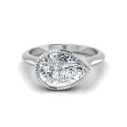 Pear cut lab grown diamond solitaire engagement ring featuring a milgrain bezel setting with a white gold tone band.
