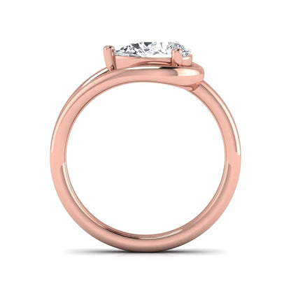 Pear cut lab grown diamond open frame solitaire engagement ring in a rose gold teardrop setting