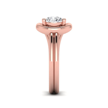 Pear cut lab grown diamond open frame solitaire engagement ring in a rose gold teardrop setting