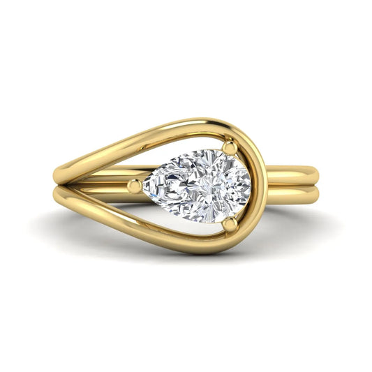 Pear cut lab grown diamond open frame solitaire engagement ring in a yellow gold teardrop setting