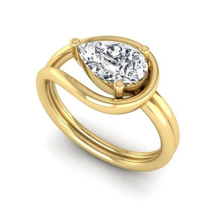 Pear cut lab grown diamond open frame solitaire engagement ring in a yellow gold teardrop setting