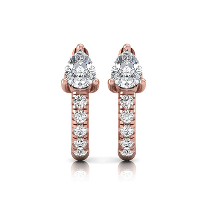 Pear cut lab grown diamond huggie hoop earrings featuring a three prong basket set center diamond with round brilliant pavé diamonds on a rose gold hinged hoop.