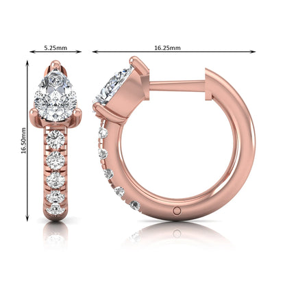 Pear cut lab grown diamond huggie hoop earrings featuring a three prong basket set center diamond with round brilliant pavé diamonds on a rose gold hinged hoop.