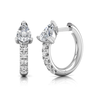 Pear cut lab grown diamond huggie hoop earrings featuring a three prong basket set center diamond with round brilliant pavé diamonds on a white gold hinged hoop.